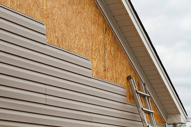 Professional Vinyl Siding technician working in Fayville, MA